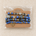 Blauwe kralenarmbandenset met levensboomhart