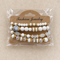 Witte Kralenarmbandenset met Goudkleurige Details